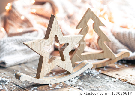 Close-up, Christmas wooden decorative figurines on a blurred background. Close-up, Christmas wooden decorative figurines on a blurred background. 137030617