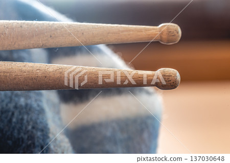 Close-up, drumsticks on a blurred background. Close-up, drumsticks on a blurred background. 137030648