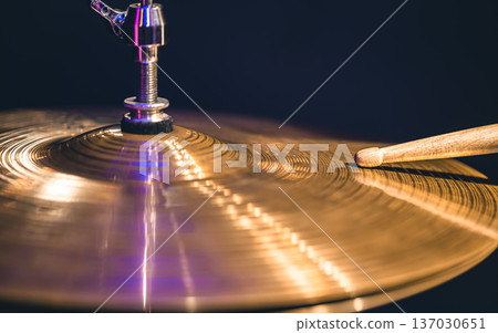 Close-up of drumsticks on a cymbal drum. 137030651