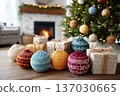 Large knit ornaments with gift packages, Cabin window frames snowfall with holiday decor, Warm wooden flooring highlights seasonal hygge inspired design elements 137030665