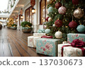 Lobby corridor lined with boutique storefronts and grand Christmas tree, polished marble walkway, upscale holiday display and ambient warm lighting for festive shoppers 137030673