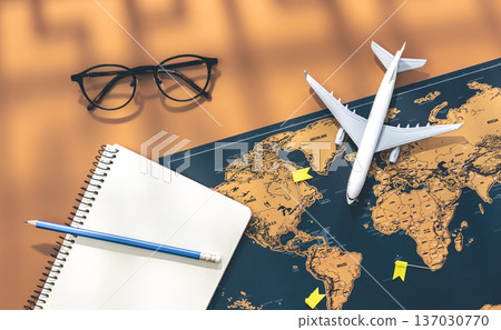 An airplane miniature, notebook and world map on brown background, flat lay. An airplane miniature, notebook and world map on brown background, flat lay. 137030770