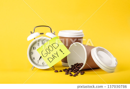 Alarm clock, paper cup, paper reminder and coffee beans on yellow background. 137030786