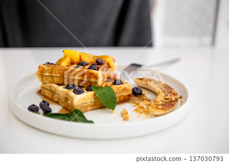 Close-up of Belgian waffles with berries and fruits. 137030793
