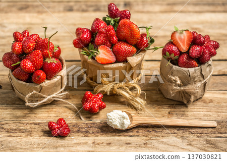 arrangement with fresh strawberries on wooden background 137030821