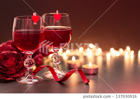 Background for Valentine's Day with glasses of wine on a blurred background. Background for Valentine's Day with glasses of wine on a blurred background. 137030916