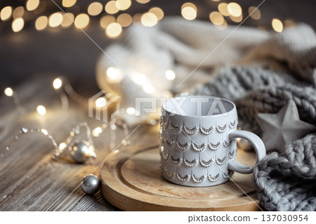 Beautiful Christmas cup on a blurred background with bokeh. 137030954