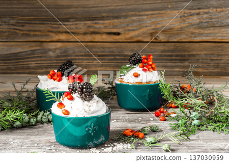 beautiful Christmas cupcake with cream and berry 137030959