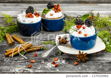 beautiful Christmas cupcake with cream and berry 137030960