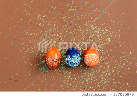 Beautiful Easter background with orange and blue decorative eggs. Beautiful Easter background with orange and blue decorative eggs. 137030979