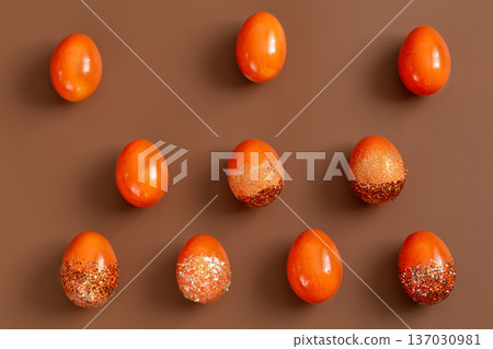 Beautiful Easter background with orange decorative eggs. 137030981