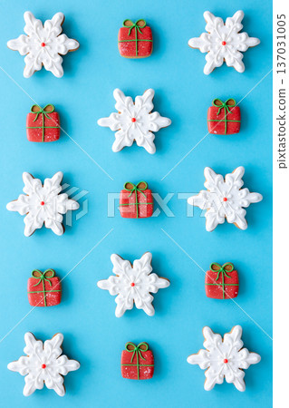 Beautiful handmade Christmas glazed gingerbread cookies on a blue background. 137031005