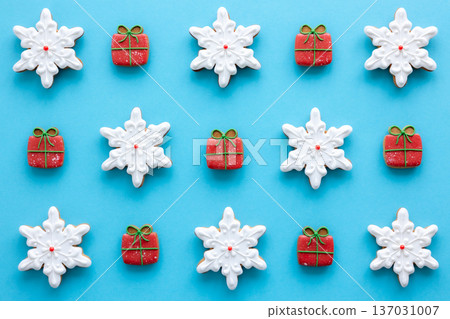 Beautiful handmade Christmas glazed gingerbread cookies on a blue background. 137031007