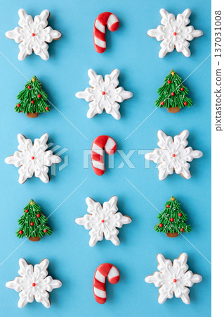 Beautiful handmade Christmas glazed gingerbread cookies on a blue background. 137031008