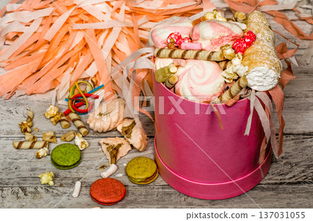 big beautiful pink box with sweets on wooden background 137031055