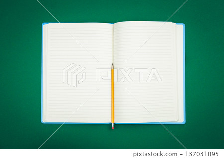 Blank notepad on green background, school concept, flat lay. Blank notepad on green background, school concept, flat lay. 137031095