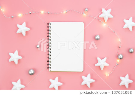 Blank notepad on pink background and decorative stars and garland, flat lay. 137031098