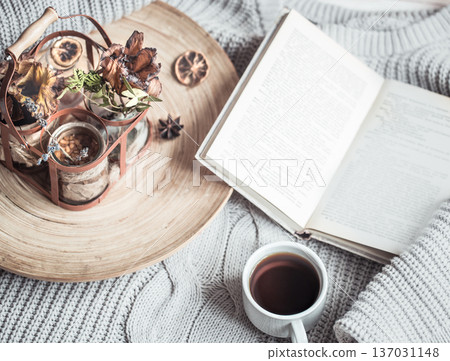 book with a cup of coffee on the bed in the home interior book with a cup of coffee on the bed in the home interior 137031148