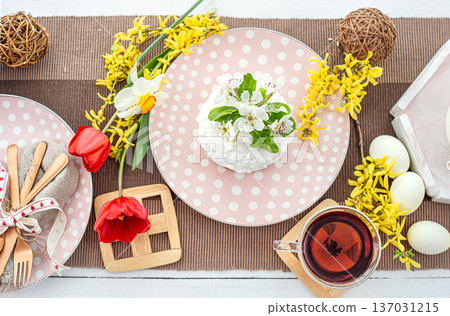 Easter composition with cake, tea and flowers top view. 137031215