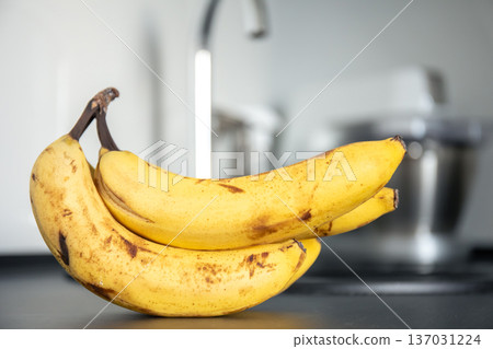 Bunch of bananas on kitchen table, close up. 137031224