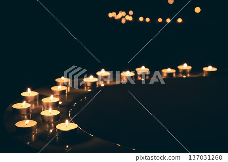Burning candles in the bathroom in the dark. 137031260