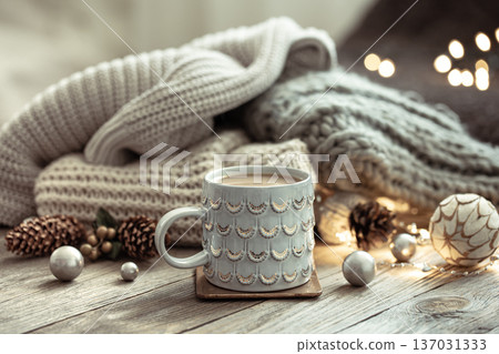 Cozy winter composition with a cup and decor details. Cozy winter composition with a cup and decor details. 137031333