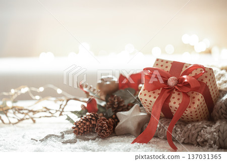 Christmas composition with new year gift on blurred light background. Christmas composition with new year gift on blurred light background. 137031365