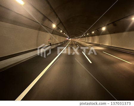 Perspective image of driving through a highway tunnel at night 137031373