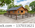 Wooden barn and horse stable with paddock in countryside 137031621