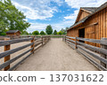 Rustic wooden barn and corral creating farm scene 137031622