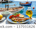 Grilled fish with tzatziki and olive oil by the sea 137031626