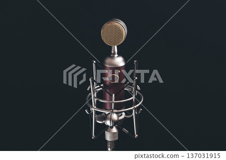 Close up of vintage microphone on a black background. Close up of vintage microphone on a black background. 137031915
