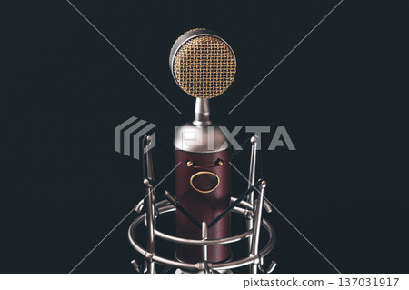 Close up of vintage microphone on a black background. Close up of vintage microphone on a black background. 137031917