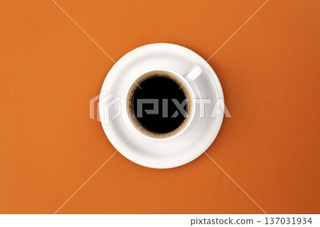 Coffee cup and saucer on brown background, flat lay. Coffee cup and saucer on brown background, flat lay. 137031934