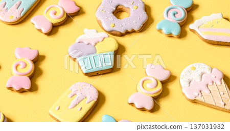 Bright cookies in glaze on a yellow background. Bright cookies in glaze on a yellow background. 137031982