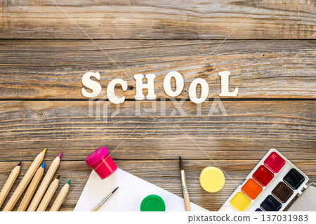 Colorful school supplies on wooden background, back to school concept. Colorful school supplies on wooden background, back to school concept. 137031983