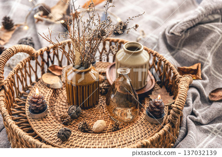 Cozy autumn composition with decorative details, candles. Cozy autumn composition with decorative details, candles. 137032139