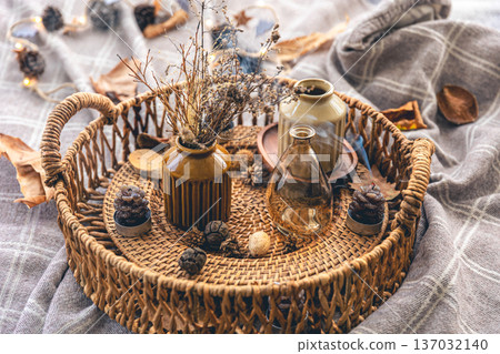 Cozy autumn composition with decorative details, candles. Cozy autumn composition with decorative details, candles. 137032140