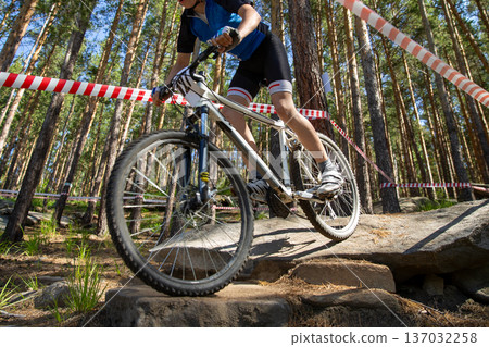 Mountain biker ride on large stones Mountain biker ride on large stones 137032258