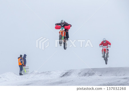 Two motocross riders airborne Two motocross riders airborne 137032268
