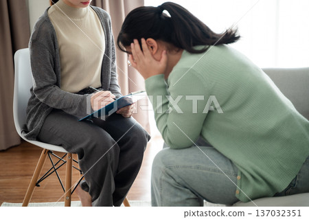 Psychologist doctor examine and listen and talking to patient with depression, mental health concept Psychologist doctor examine and listen and talking to patient with depression, mental health concept 137032351