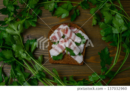 Lard "Christmas Tree" Sandwich on Wooden Table Decorated with Parsley 137032960