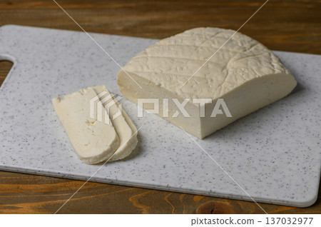 Fresh Sulguni Cheese on Rustic Kitchen Table 137032977