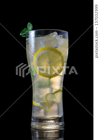 Mojito with Fresh Mint and Ice on Dark Background Mojito with Fresh Mint and Ice on Dark Background 137032999