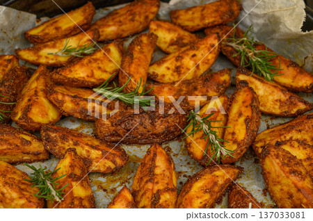 Rustic Oven-Roasted Potato Wedges with Rosemary and Thyme Rustic Oven-Roasted Potato Wedges with Rosemary and Thyme 137033081