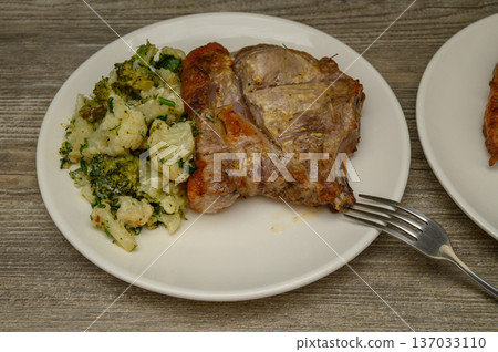 Bone-In Pork Chop Cauliflower Herb Combination Plate Bone-In Pork Chop Cauliflower Herb Combination Plate 137033110