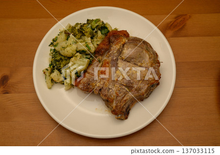 Top View of Fried Pork Chop with Broccoli and Cauliflower 137033115