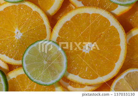 Fresh Orange and Lime Round Slices Background 137033130