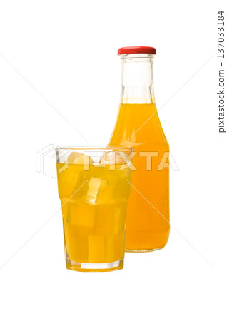 Orange Juice Bottle and Full Glass with Ice on White Background Orange Juice Bottle and Full Glass with Ice on White Background 137033184