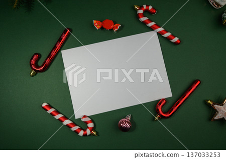 Festive Holiday Card with Candy Cane Frame on Green Backdrop 137033253